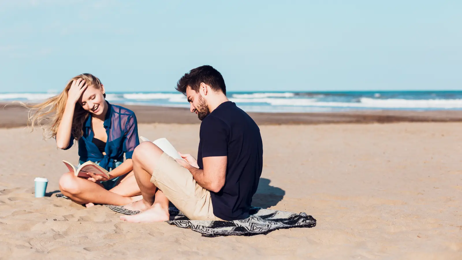 Romantic couple sitting together outdoors in natural light Romantic couple sitting together outdoors in natural light