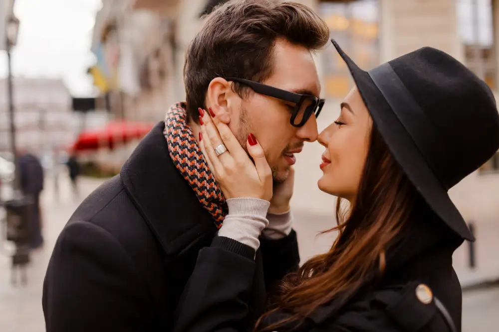 Happy engaged couple sharing a romantic moment outdoors Happy engaged couple sharing a romantic moment outdoors