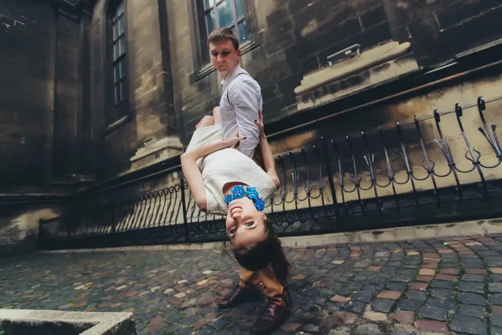 Creative engagement photography pose with a gentle and playful dip Creative engagement photography pose with a gentle and playful dip